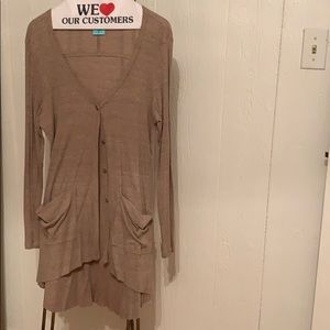 Thin buttoned down cardigan. Fits high-low.